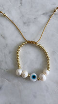 Pearl/evil eye bracelet