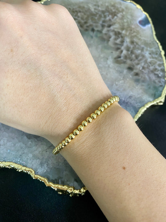 Single beads in gold